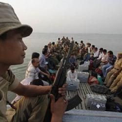 Election officials and security personnel along with EVM