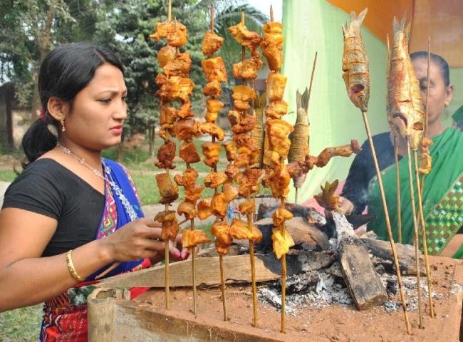 Women preparing traditional food during  Ethnic Food Festival 2012