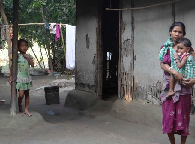 A Displaced Koch Rajbanshi woman with her children