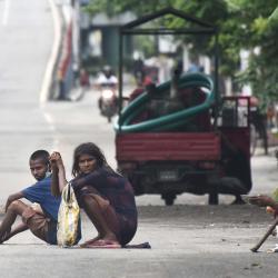Beggars in the empty GS Road, near Bhangarh during Lockdown in the city on Sunday.  Photo by UB photos