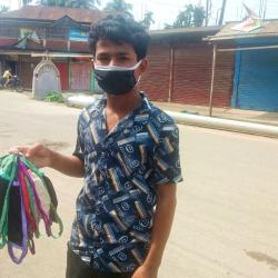 A boy selling masks in Hailakandi town, Assam 23-04-2020 during lockdown. Photo by UB Photos.