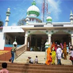 Pao Mecca Mosque at Hajo, Kamrup Dist, Assam  , where a  group of both men and women devotees are entering the mosque.