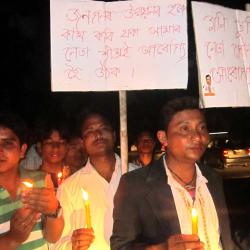 Candle light prayer at Narayanpur for quick recovery of Mani Kumar Subba