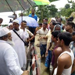 AIUDF Chief Badruddin Ajmal meeting flood affected  villagers at Bilashipara in Dhubri on Wednesday. Photo by UB Photos.