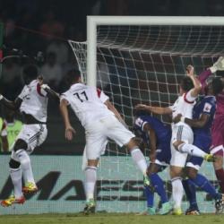 Chennaiyin FC goalkeeper Gennaro Bracigliano fails to make the save as Massamba Lo Sambou of NorthEast (far Left) United FC scores the second goal during match 42 of the Hero Indian Super League between NorthEast United FC and Chennaiyin FC held at the Indira Gandhi Stadium, Guwahati, India on the 27th November 2014. Photo by: Shaun Roy/ ISL/ SPORTZPICS