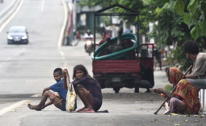 Beggars in the empty GS Road, near Bhangarh during Lockdown in the city on Sunday.  Photo by UB photos