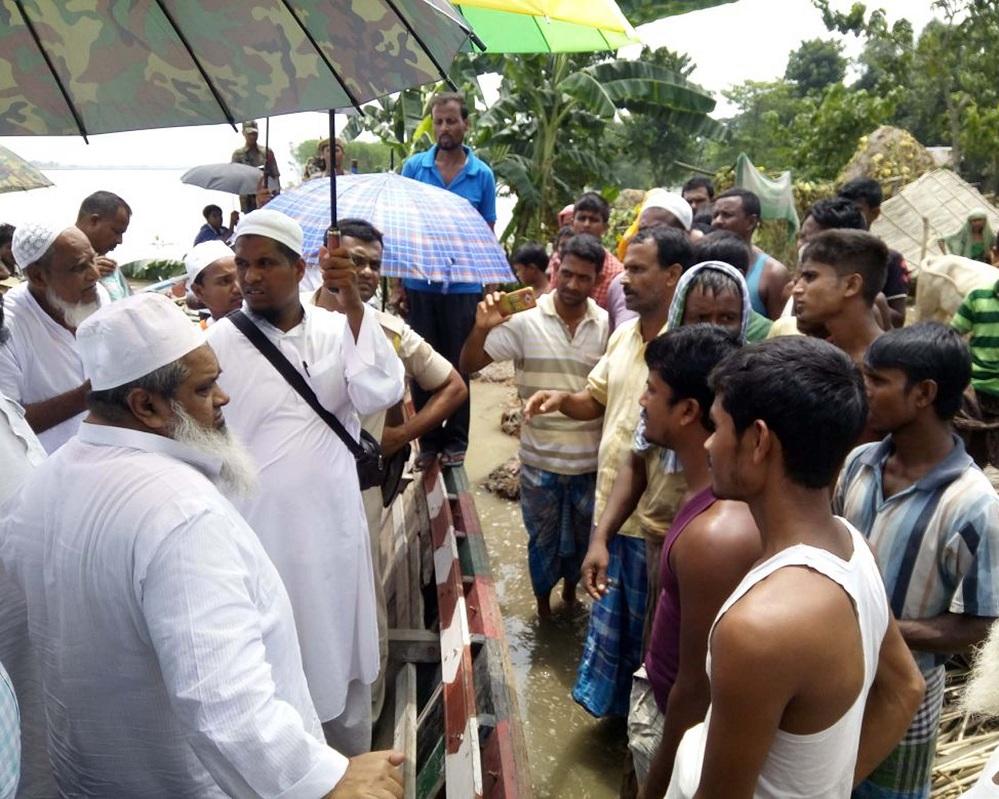 AIUDF Chief Badruddin Ajmal meeting flood affected  villagers at Bilashipara in Dhubri on Wednesday. Photo by UB Photos.
