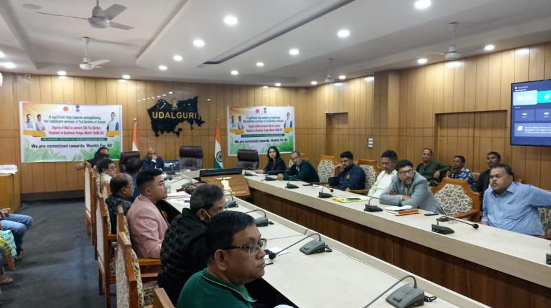  Representatives of tea garden along with district administration officials during the signing of the MoU at District Commissioner office in Udalguri on Wednesday. 