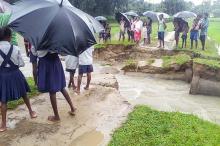 Flood water washed away portion of a road at Mijika in Biswanath Chariali on Friday. Photo by UB Photos.