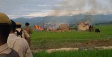 The burnung hemlet: thatched houses set on fire by miscreants in Uriam Ghat area. Photo: Bibeka Dutta