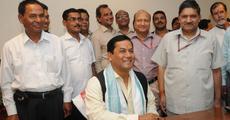 Sonowal assumes charges