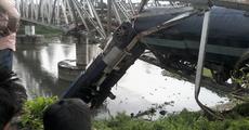Train slips into river:2 hurt