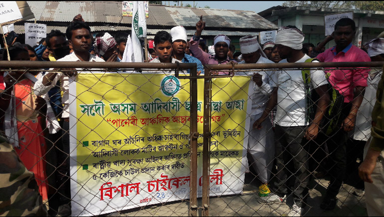 Adivasi students cycles for land pattas