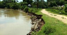 Breached embankments of Noa river causing flood 