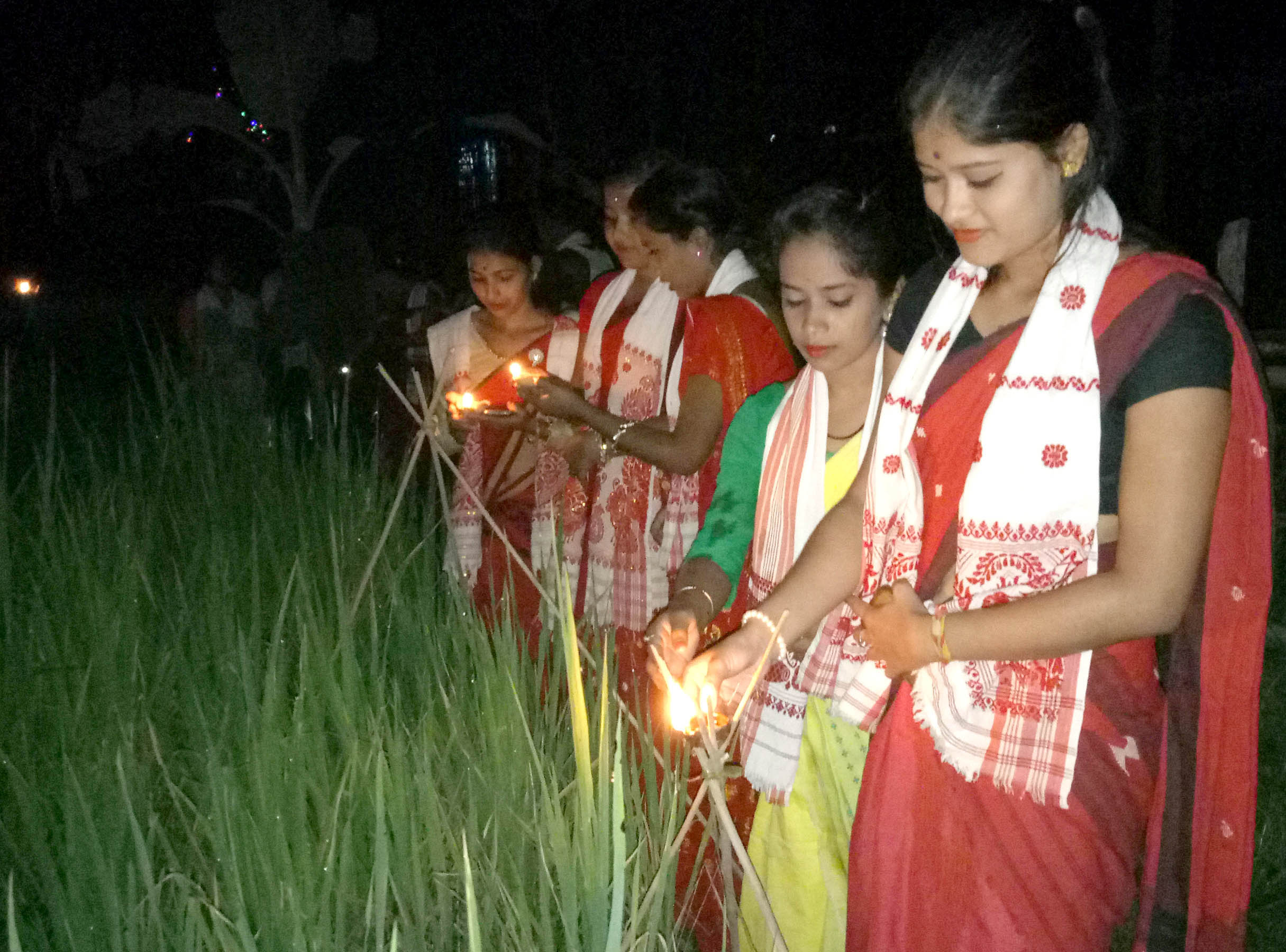 Earthen lamps illuminating Kati Bihu glory