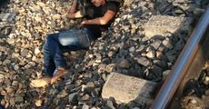 Boy jumps off running train