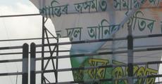 After the blast: an irrate mob tearing Congress posters