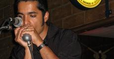 Indian harmonica player creating waves globally