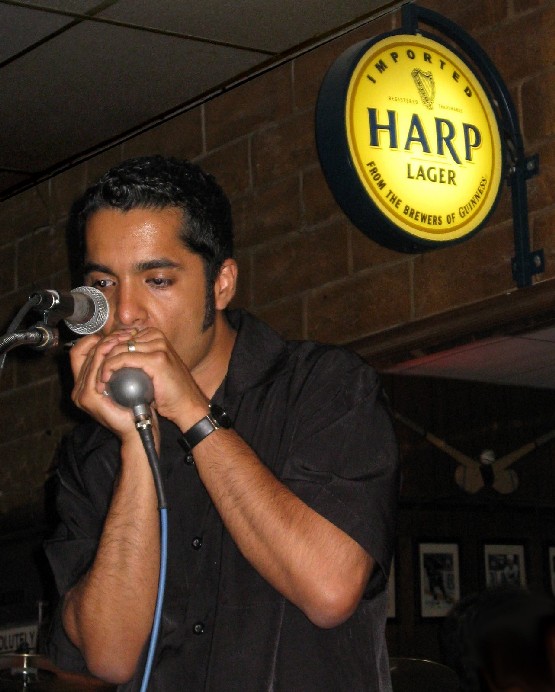 Indian harmonica player creating waves globally