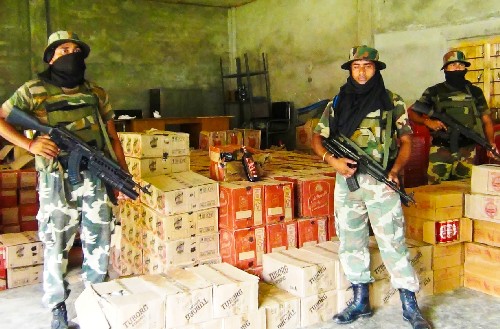 CRPF seize illegal liquor and timber at Merapani